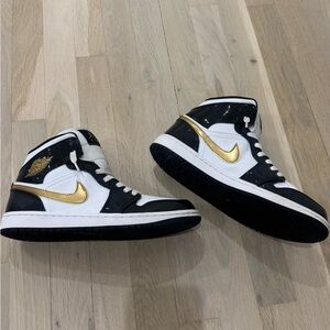 Air Jordan Retro 1 Mid Black and Gold Sneakers